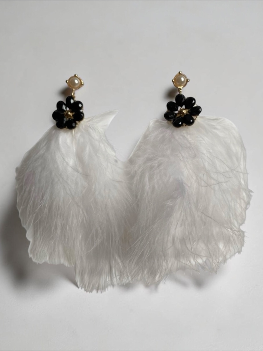 Elegant Handmade White Feather Earrings with Black Floral Accent